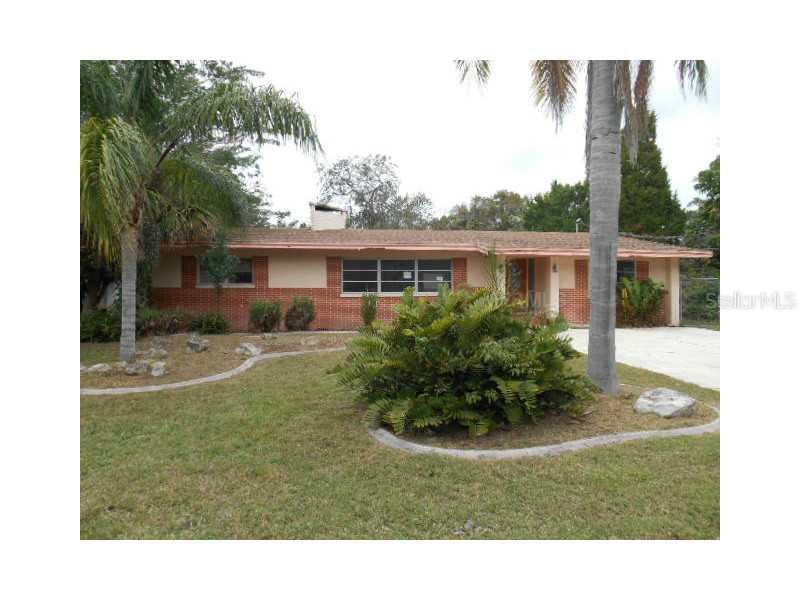 6113 River Road New Port Richey, FL 34652 - Photo 1 of 1 a view of backyard with a garden and plants