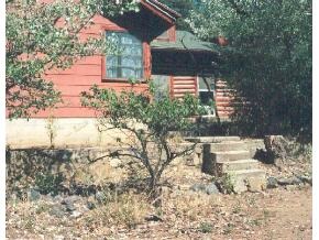 922 East Friendly Pines Road Prescott, AZ 86303 - Photo 4 of 9 a backyard of a house with large trees and plants
