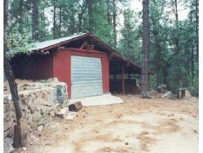 922 East Friendly Pines Road Prescott, AZ 86303 - Photo 6 of 9 a backyard of a house with table and chairs