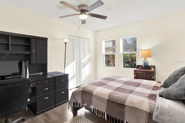 a bedroom with a bed and a window