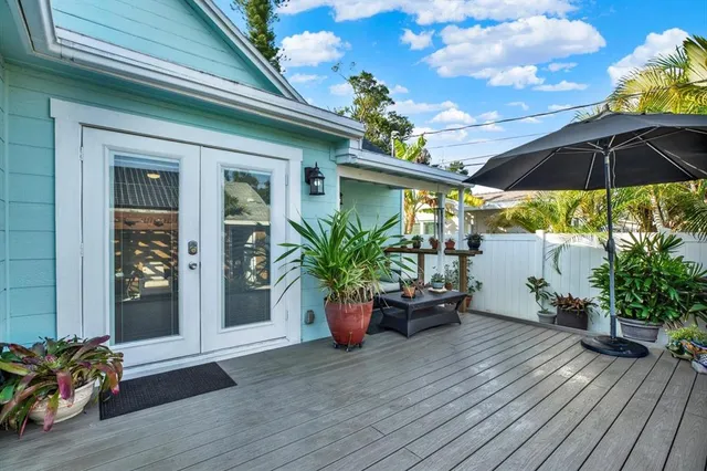 a view of a chair and tables in patio of the house
