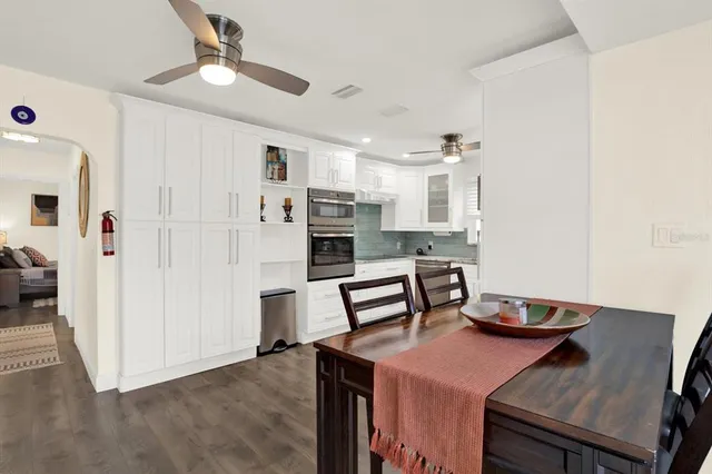 a kitchen with stainless steel appliances granite countertop a stove and a refrigerator