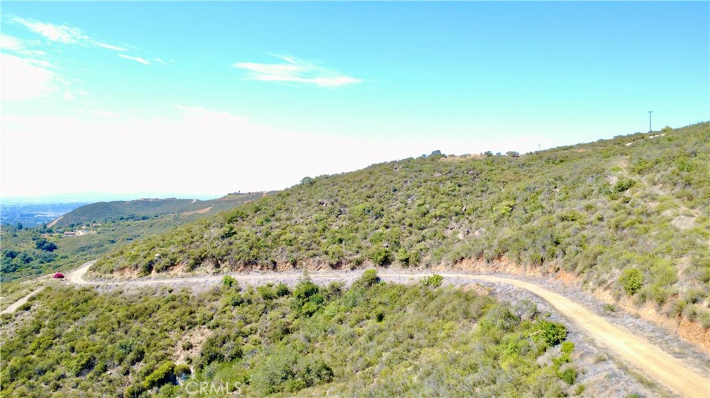 0 Sunset Peak Pala, CA 92059 - Photo 11 of 18 a view of a large window with mountains in the background