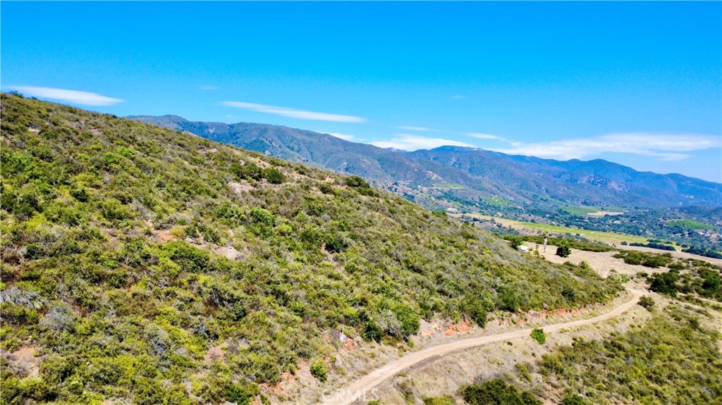 0 Sunset Peak Pala, CA 92059 - Photo 13 of 18 a view of a large mountain with mountains in the background