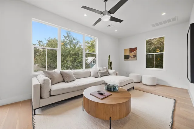 a living room with furniture and a large window