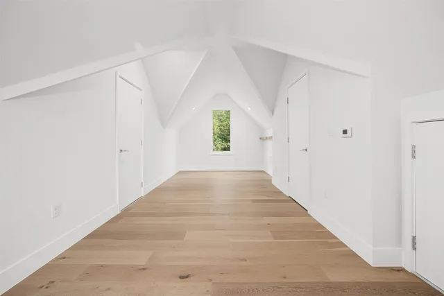a view of an entryway with wooden floor