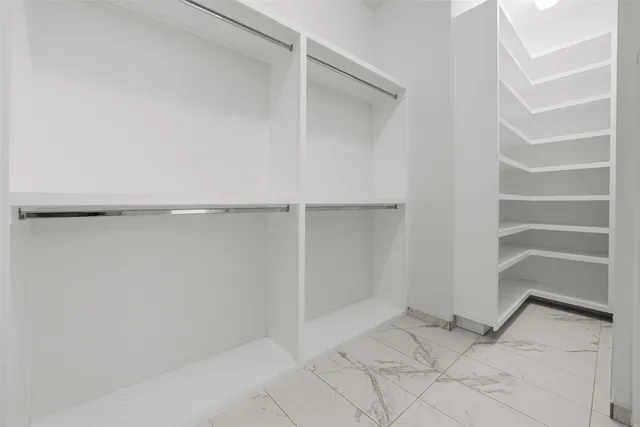 a view of an empty walk in closet