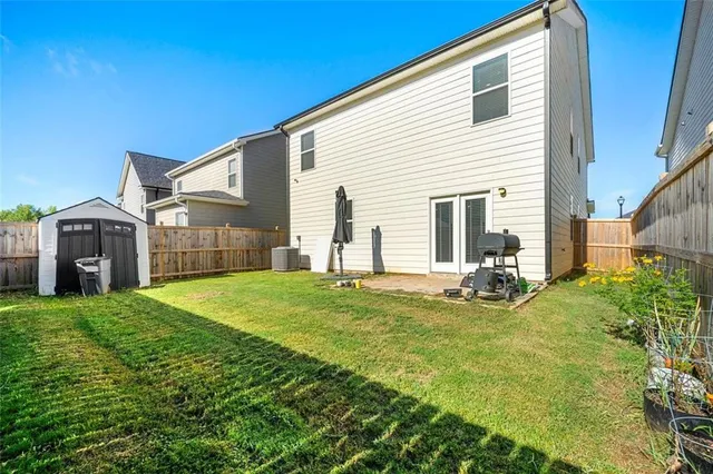 a view of a backyard of the house