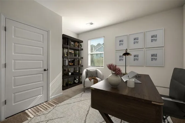 a view of a dining room with furniture and window