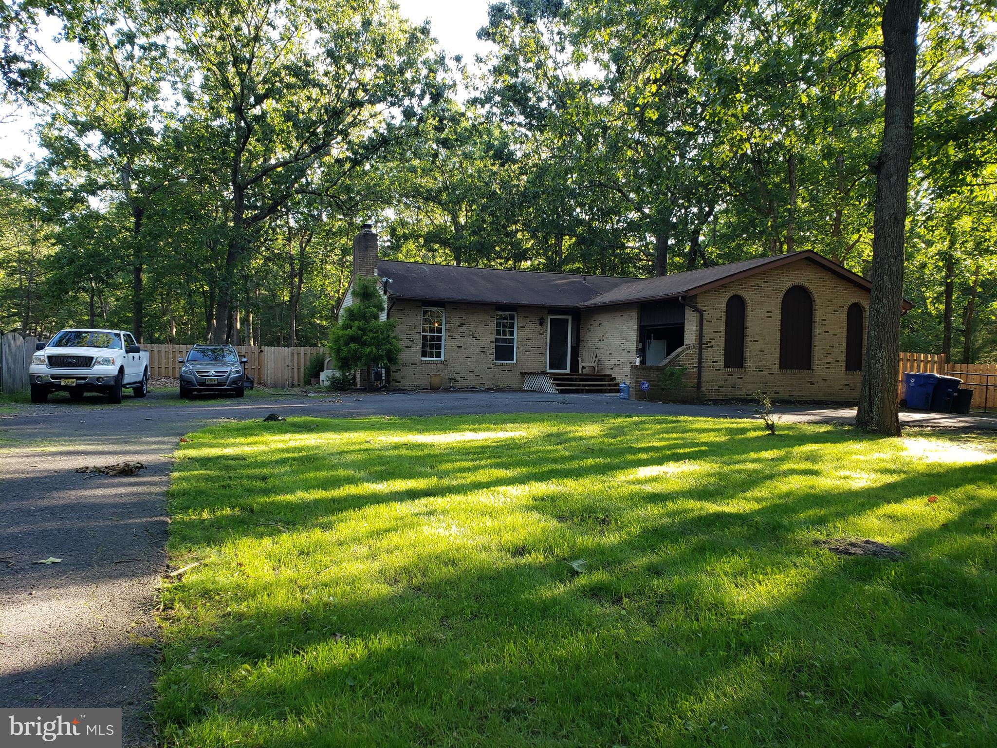 153 Sooy Place Road Tabernacle, NJ 08088 - Photo 1 of 18 a front view of a house with swimming pool
