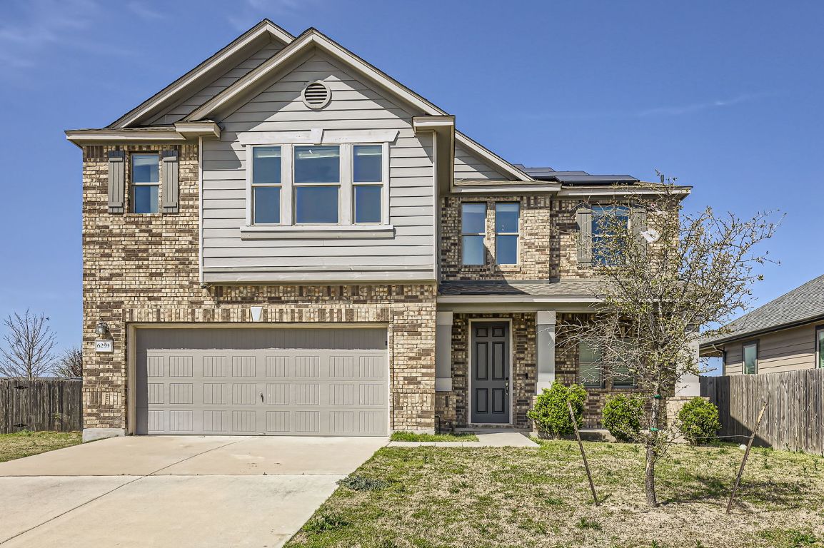 6293 Mantalcino Drive Round Rock, TX 78665 - Photo 1 of 1 a front view of a house with garden