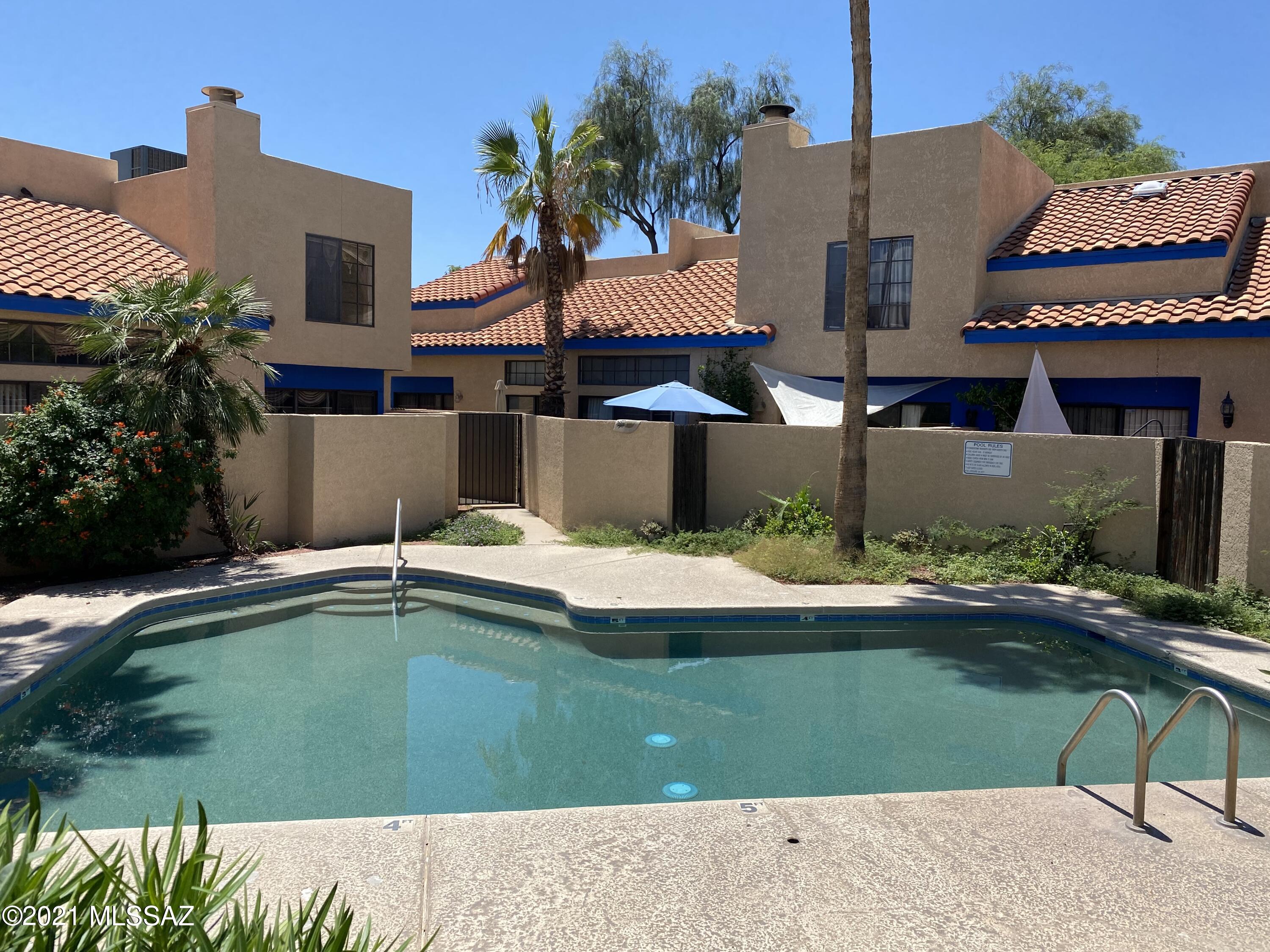 210 East Pastime Road Tucson, AZ 85705 - Photo 29 of 29 a view of a house with a swimming pool