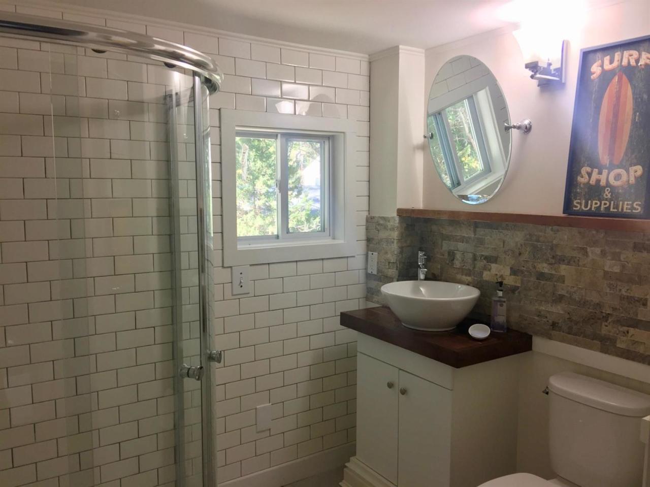 133 Old Town Road Hyannis, MA 02601 - Photo 20 of 29 a bathroom with a sink a vanity and a mirror