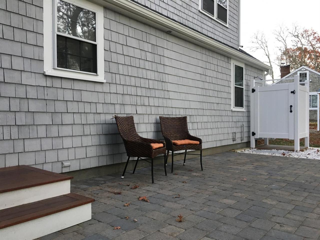 133 Old Town Road Hyannis, MA 02601 - Photo 26 of 29 a backyard of a house with table and chairs