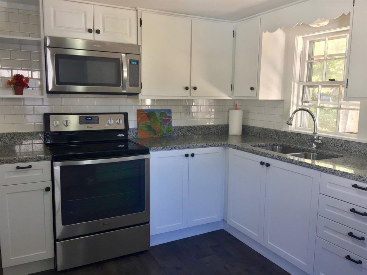 133 Old Town Road Hyannis, MA 02601 - Photo 4 of 29 a kitchen with granite countertop white cabinets and appliances