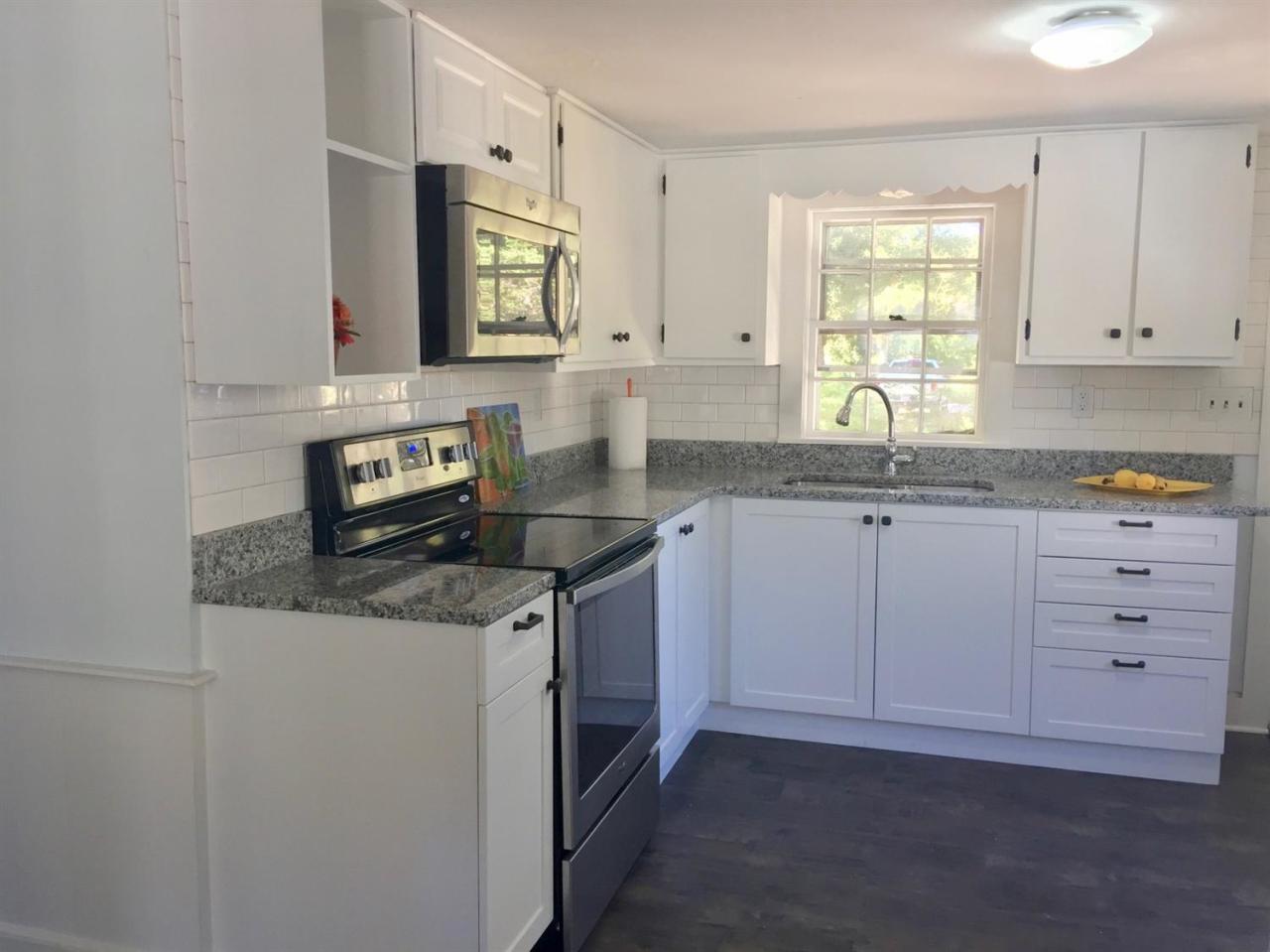 133 Old Town Road Hyannis, MA 02601 - Photo 5 of 29 a kitchen with stainless steel appliances granite countertop a sink stove and cabinets