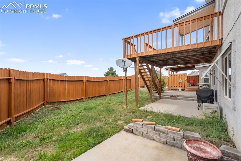 18895 Sage Crest Road Peyton, CO 80831 - Photo 33 of 38 a view of a backyard with wooden fence