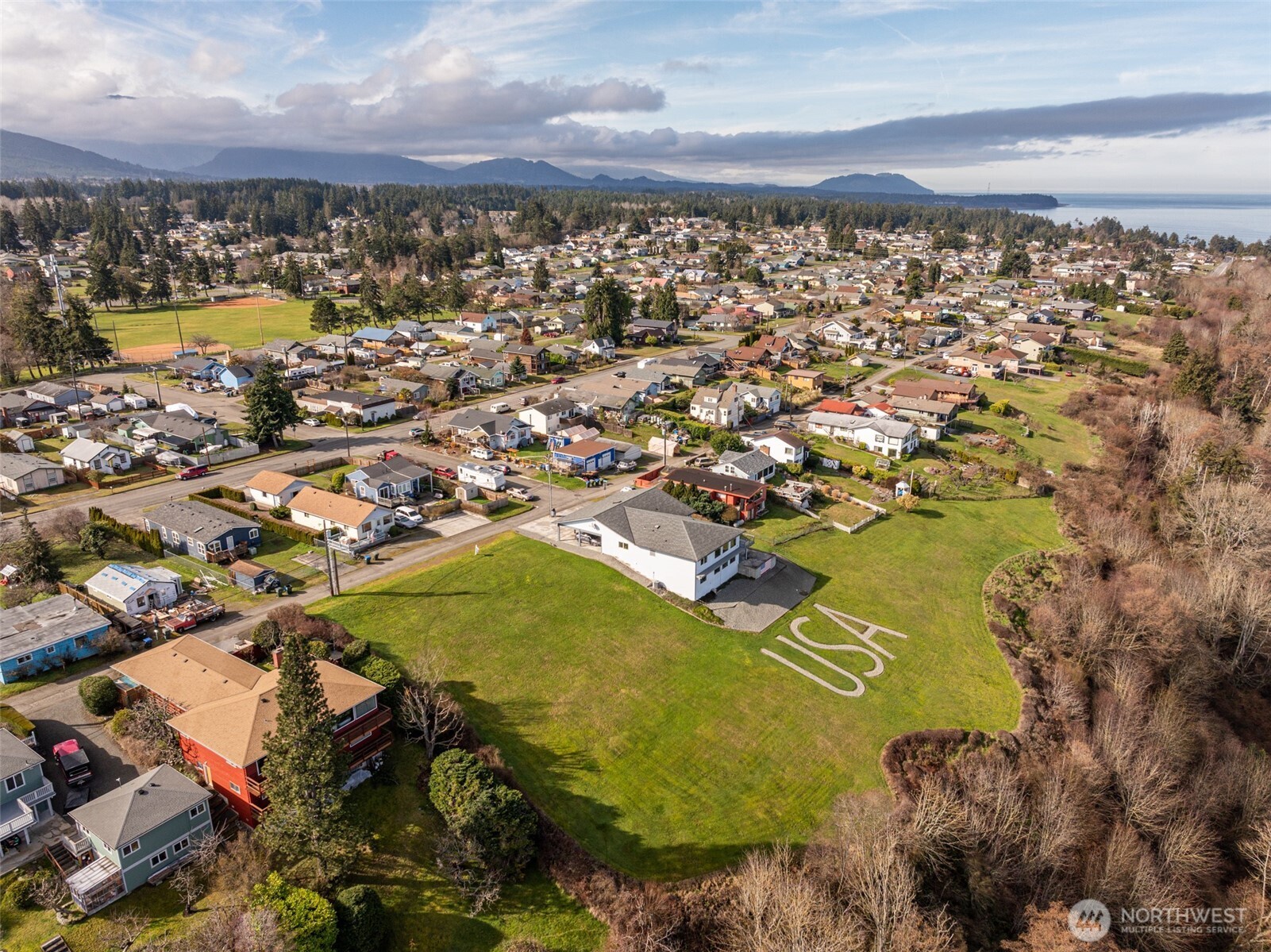 999 West 4th Street Port Angeles, WA 98363 - Photo 11 of 22 an aerial view of residential houses with outdoor space