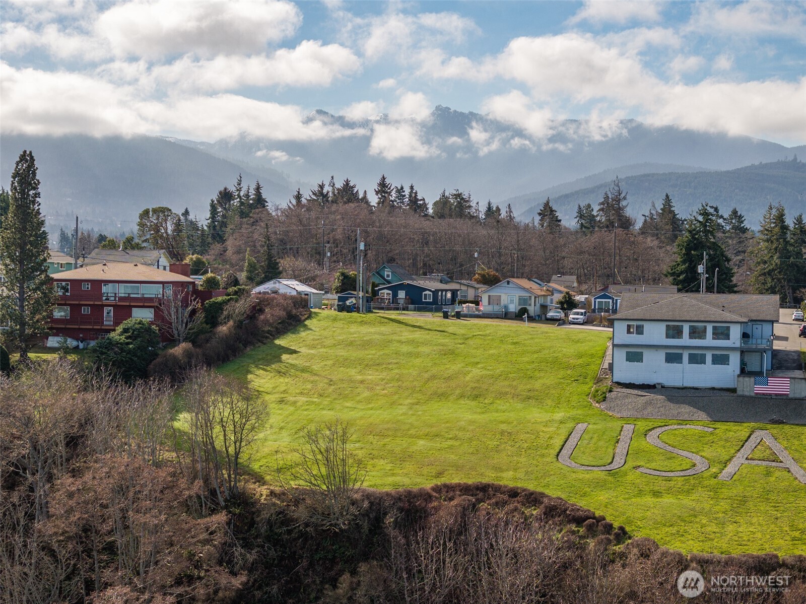 999 West 4th Street Port Angeles, WA 98363 - Photo 4 of 22 a view of a lake with a house in the background