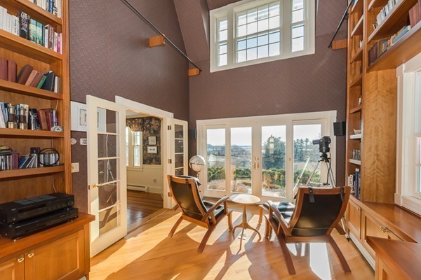 208 Argilla Road Ipswich, MA 01938 - Photo 12 of 30 a view of a livingroom with furniture and floor to ceiling windows