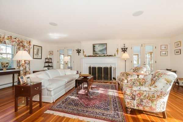 208 Argilla Road Ipswich, MA 01938 - Photo 8 of 30 a living room with furniture a fireplace and a table