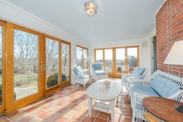 208 Argilla Road Ipswich, MA 01938 - Photo 9 of 30 a living room with furniture and a floor to ceiling window