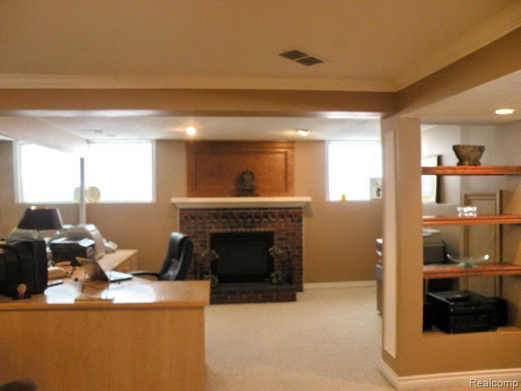 3975 Oak Pointe Court Rochester, MI 48306 - Photo 32 of 39 Lower Level Office With Fireplace