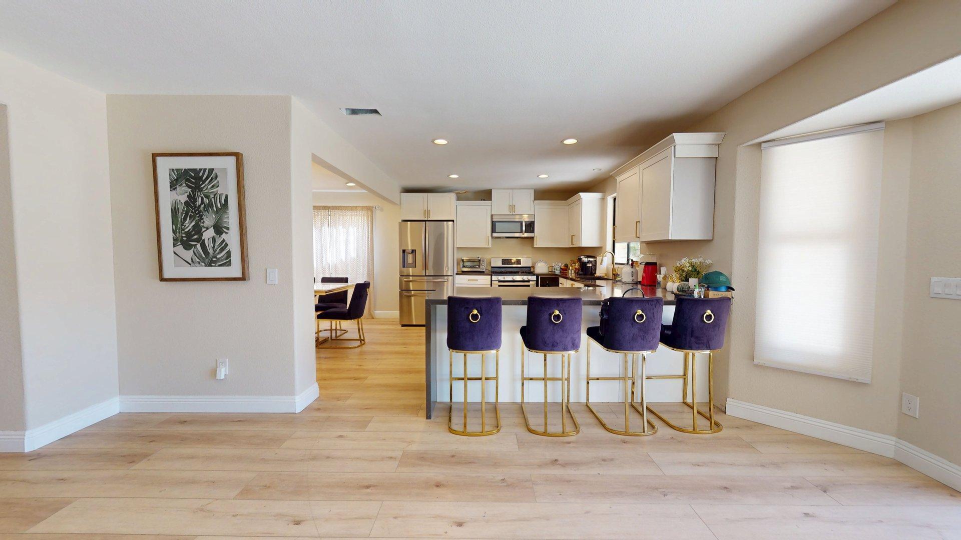 68645 Panorama Road Cathedral City, CA 92234 - Photo 12 of 35 a kitchen with stainless steel appliances kitchen island granite countertop a refrigerator and cabinets