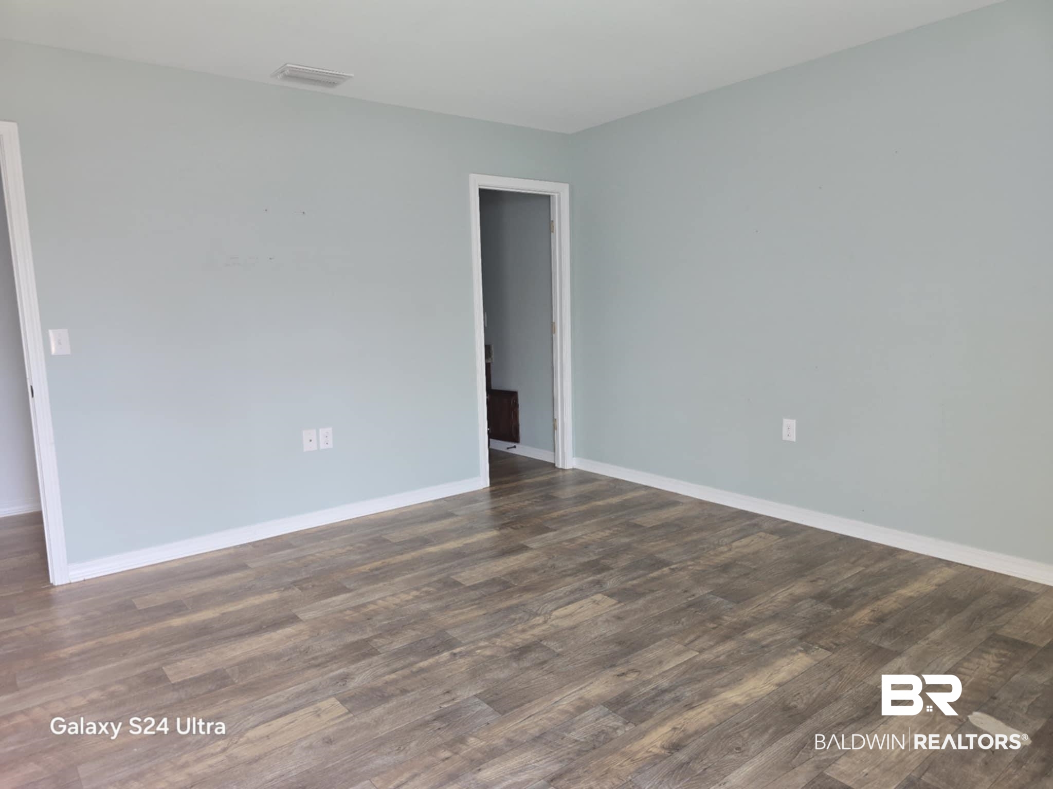 546 Wolf Log Road Flomaton, AL 36441 - Photo 8 of 15 Empty room with hardwood / wood-style flooring