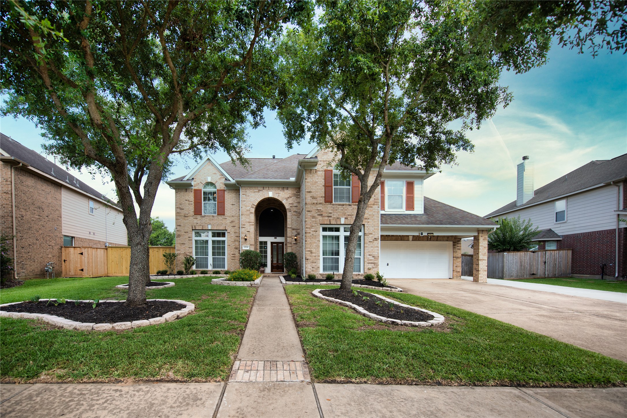 1914 Lakeside Crossing Katy, TX 77494 - Photo 1 of 44 a front view of a house with yard and green space