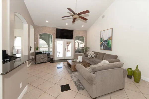 a living room with furniture and a flat screen tv