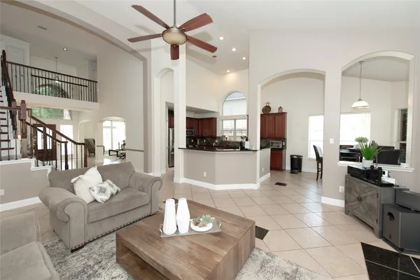a kitchen with granite countertop a sink stove and cabinets