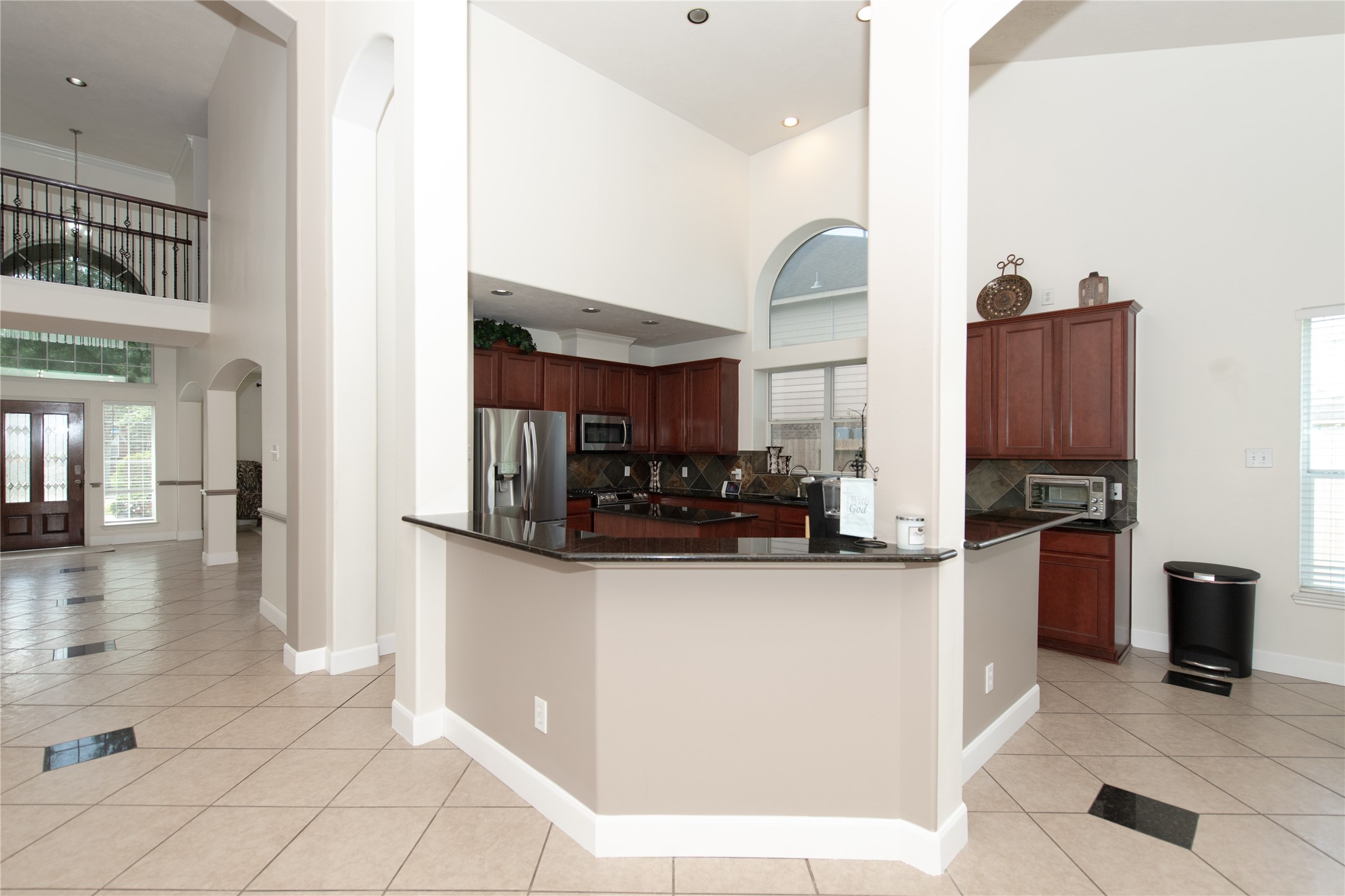 1914 Lakeside Crossing Katy, TX 77494 - Photo 18 of 44 a kitchen with stainless steel appliances granite countertop a refrigerator and a stove top oven
