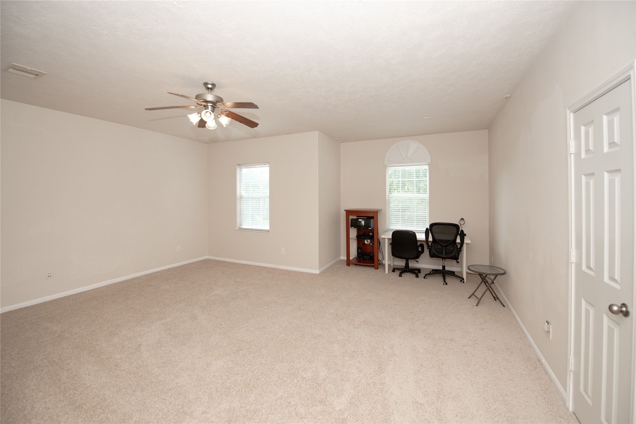 1914 Lakeside Crossing Katy, TX 77494 - Photo 27 of 44 an empty room with windows and closet
