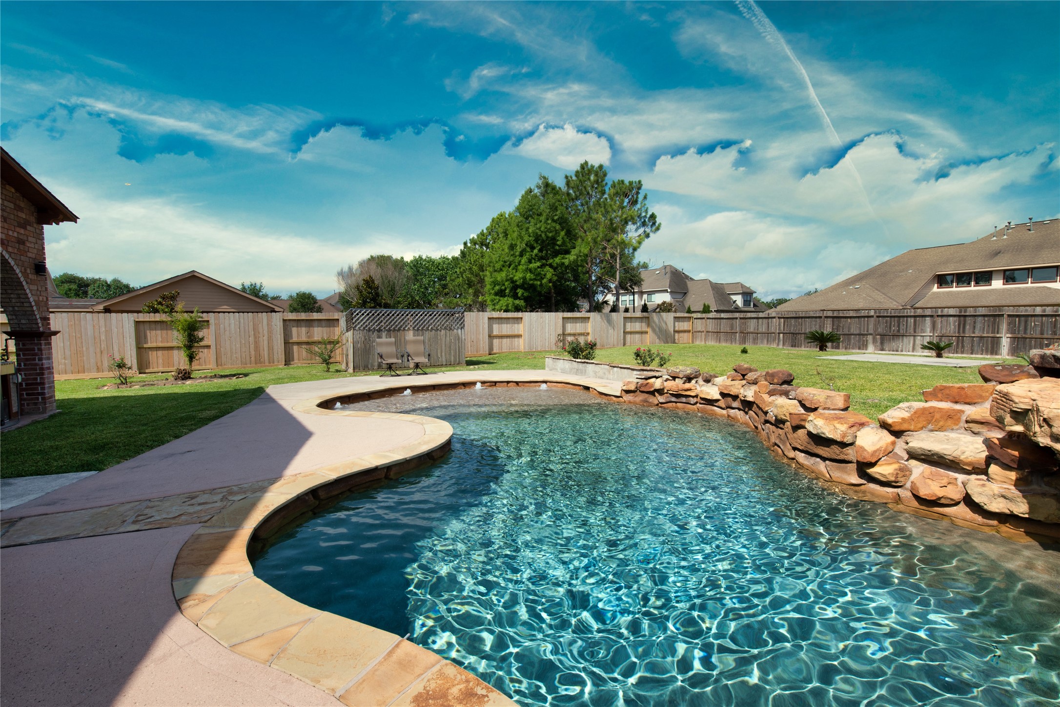 1914 Lakeside Crossing Katy, TX 77494 - Photo 36 of 44 a view of a swimming pool with a patio