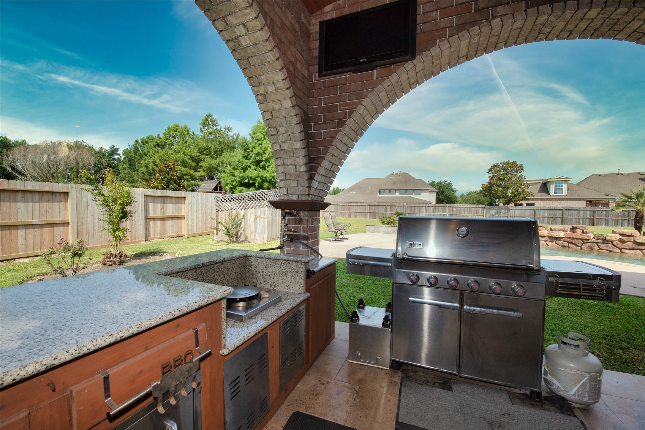 1914 Lakeside Crossing Katy, TX 77494 - Photo 39 of 44 a view of a kitchen with a sink and a stove