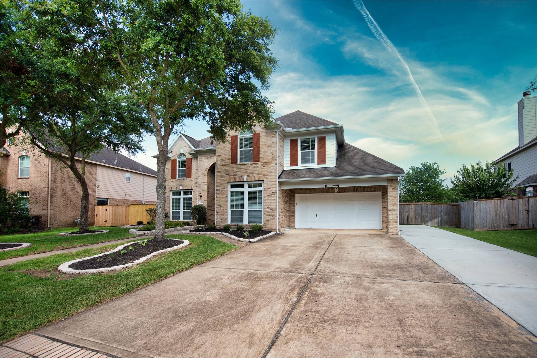 1914 Lakeside Crossing Katy, TX 77494 - Photo 41 of 44 a front view of a house with a yard and garage