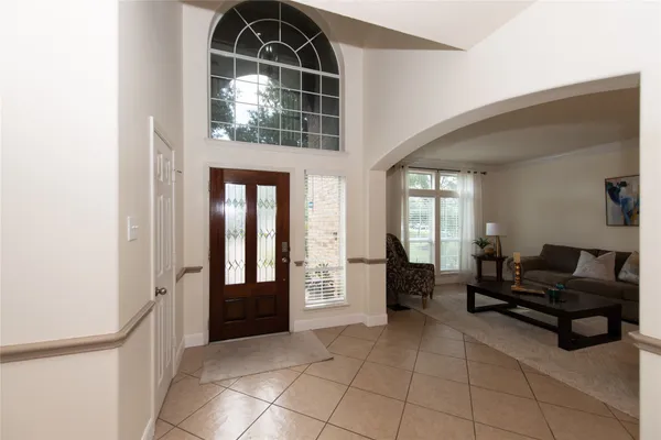 a lobby with furniture and floor to ceiling window