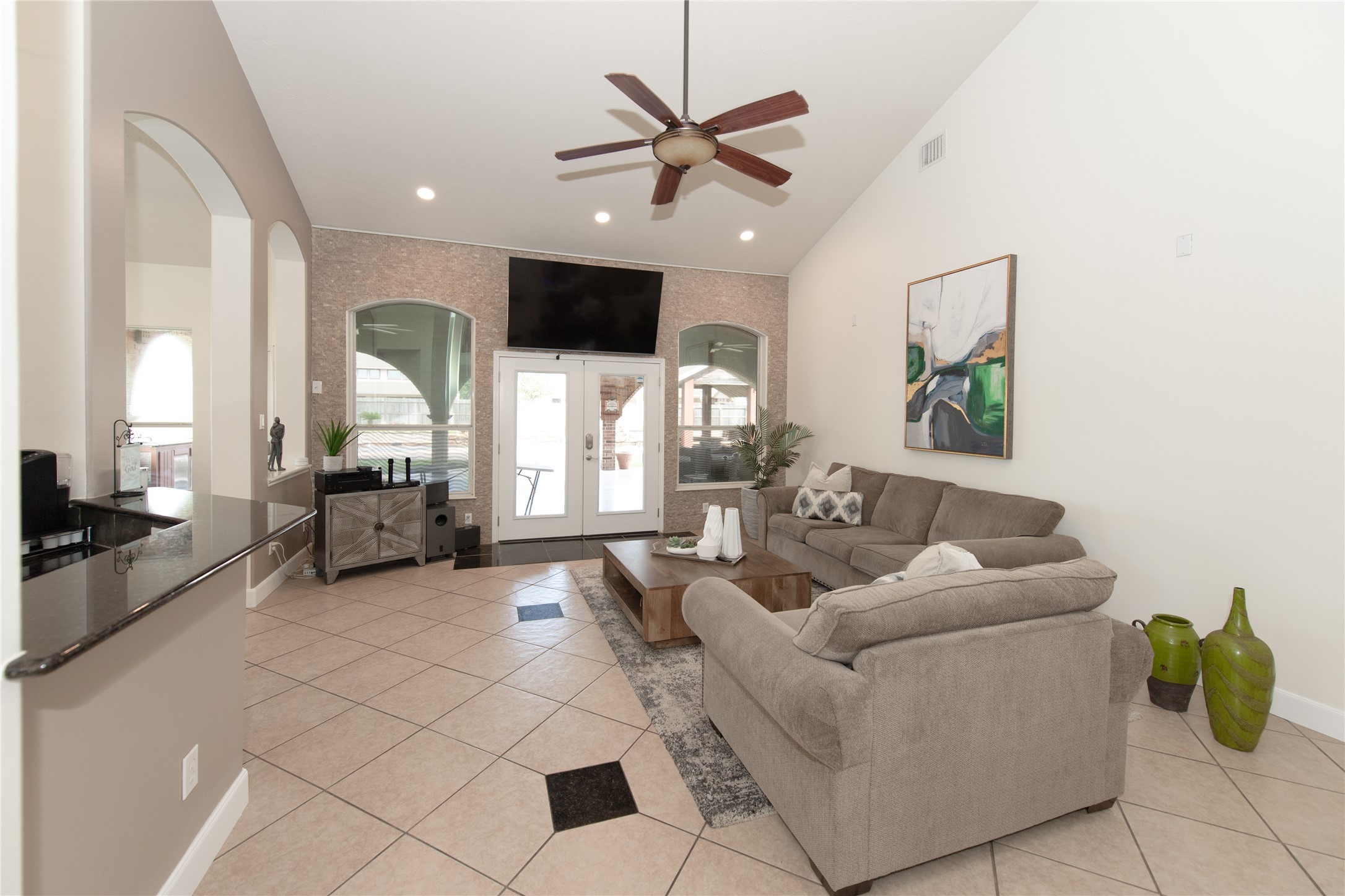 1914 Lakeside Crossing Katy, TX 77494 - Photo 9 of 44 a living room with furniture and a chandelier