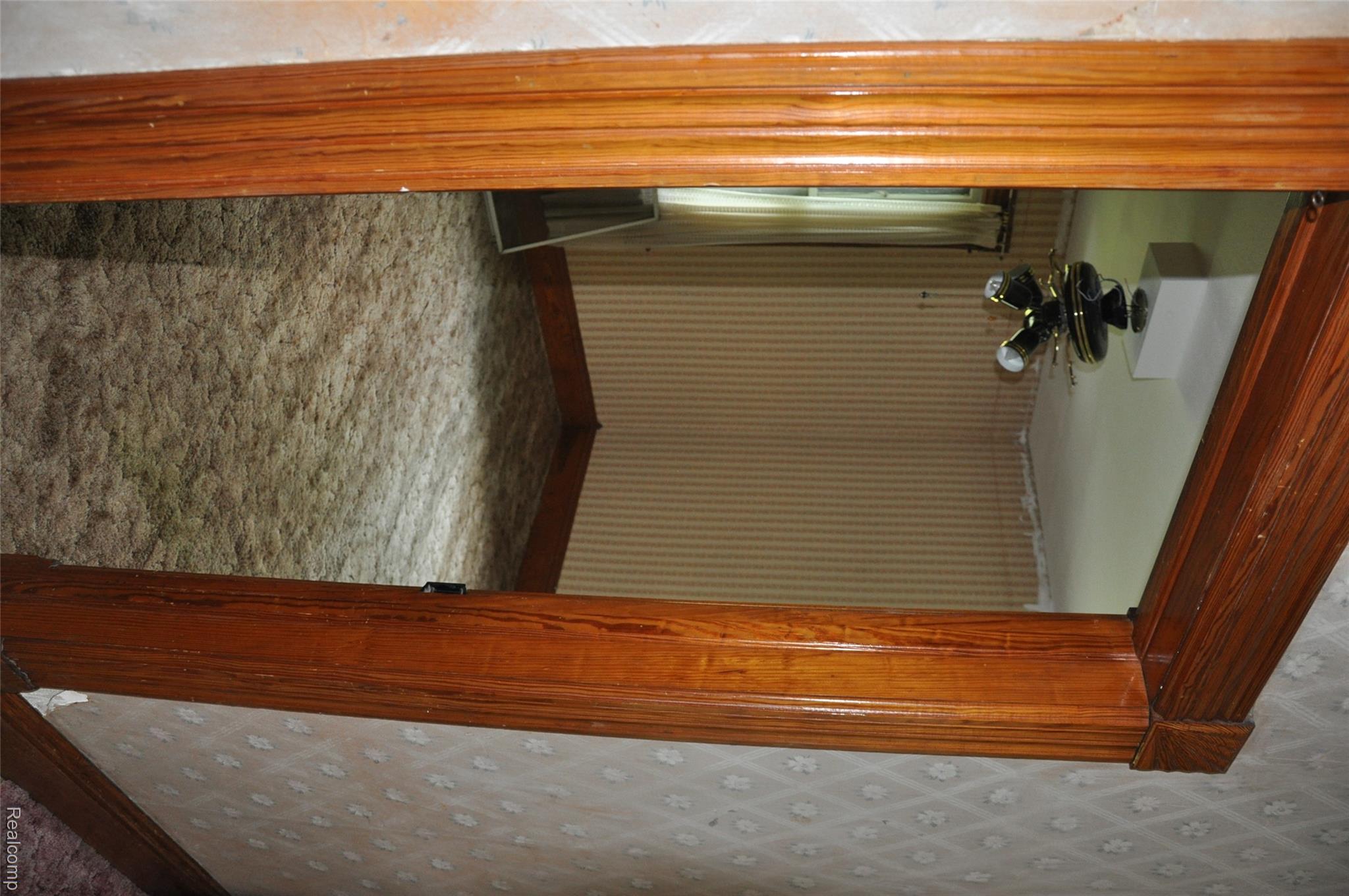 3954 Mayville Road Silverwood, MI 48760 - Photo 21 of 30 Wood-finish door frame with detailed trim