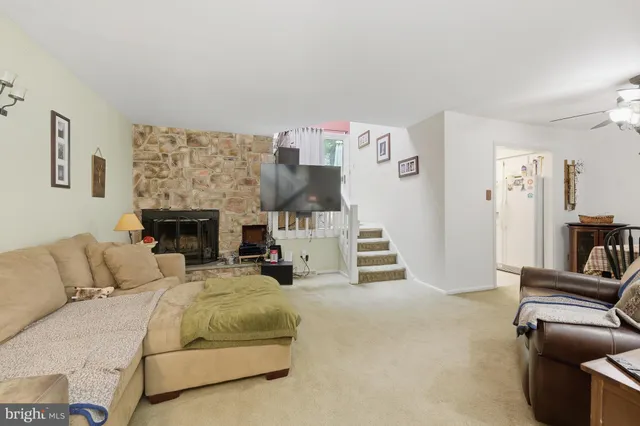 a bedroom with furniture and a fireplace