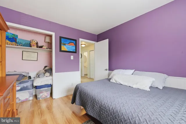 a bedroom with a bed and a chair