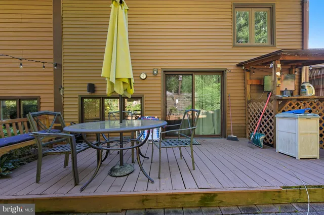 a view of a chairs and table in a patio