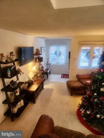 a room with furniture and a flat screen tv