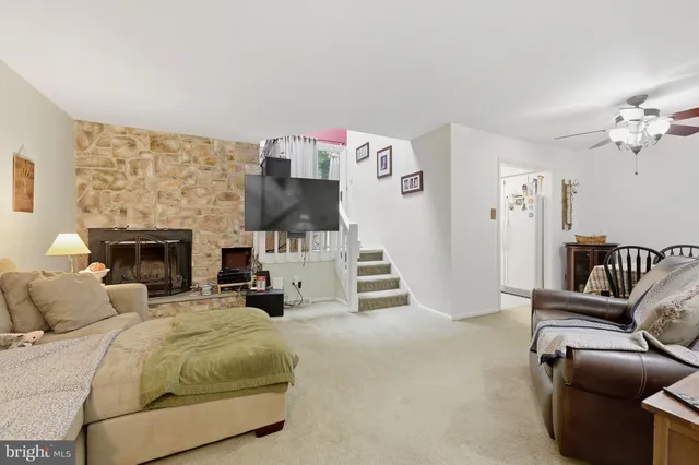 a bedroom with furniture and a fireplace