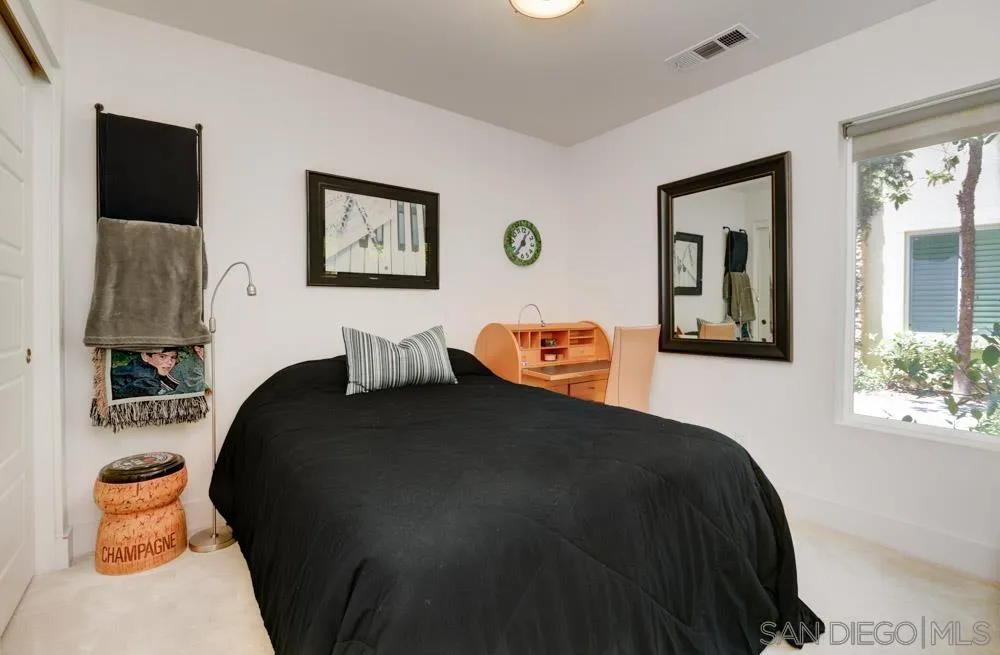 7832 Inception Way San Diego, CA 92108 - Photo 11 of 31 a bedroom with a bed and a lamp on dresser