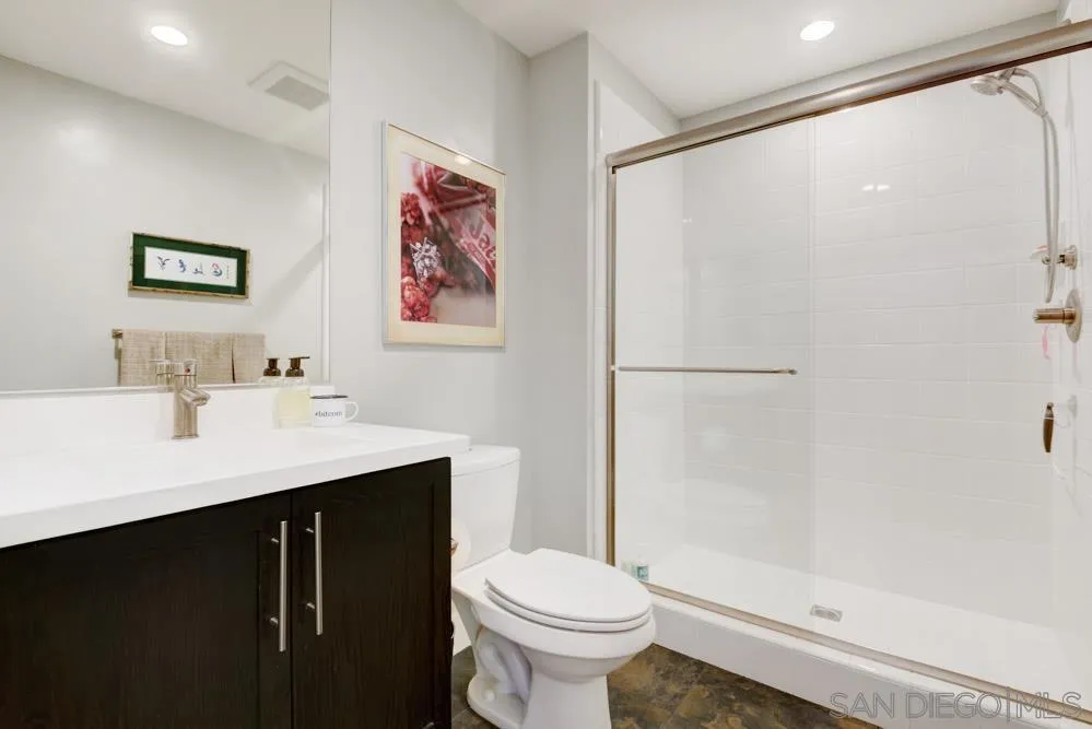 7832 Inception Way San Diego, CA 92108 - Photo 12 of 31 a bathroom with a sink and a mirror