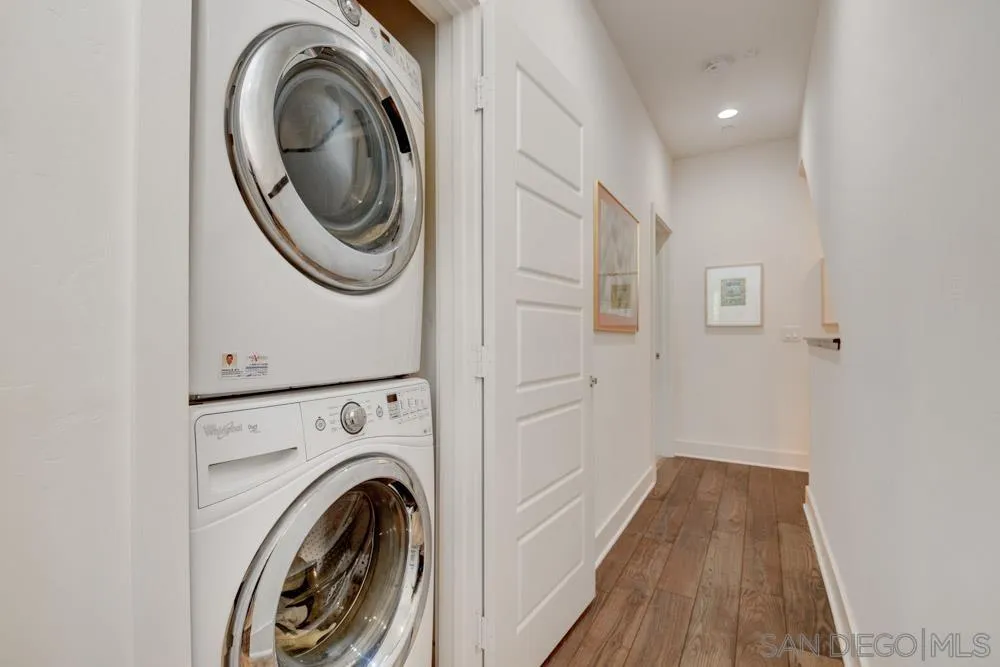 7832 Inception Way San Diego, CA 92108 - Photo 16 of 31 a view of a hallway with washer and dryer