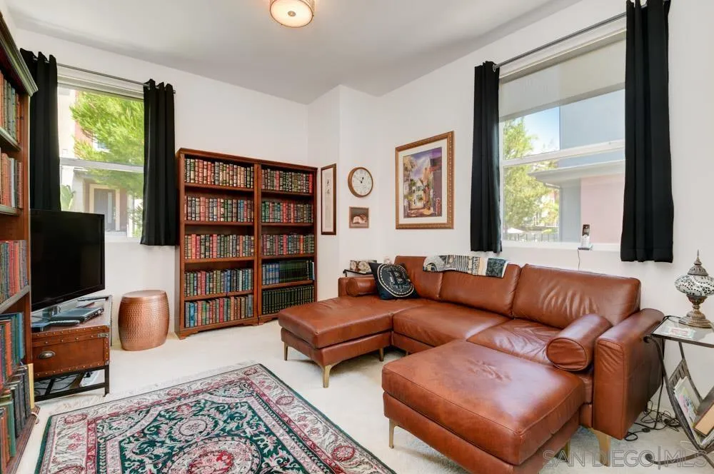 7832 Inception Way San Diego, CA 92108 - Photo 17 of 31 a living room with furniture and a flat screen tv