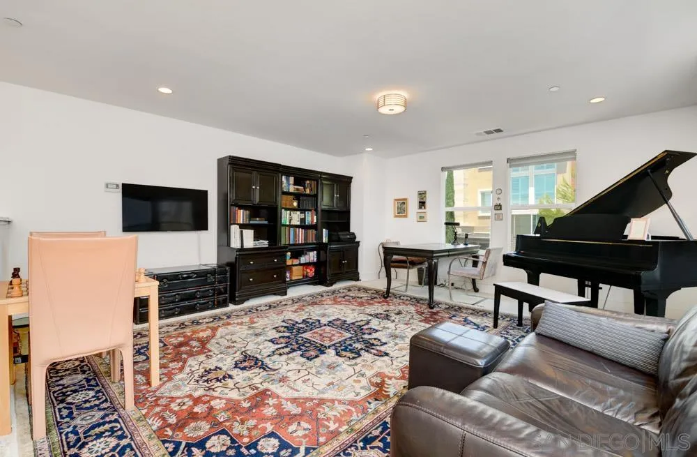 7832 Inception Way San Diego, CA 92108 - Photo 19 of 31 a living room with furniture and a flat screen tv